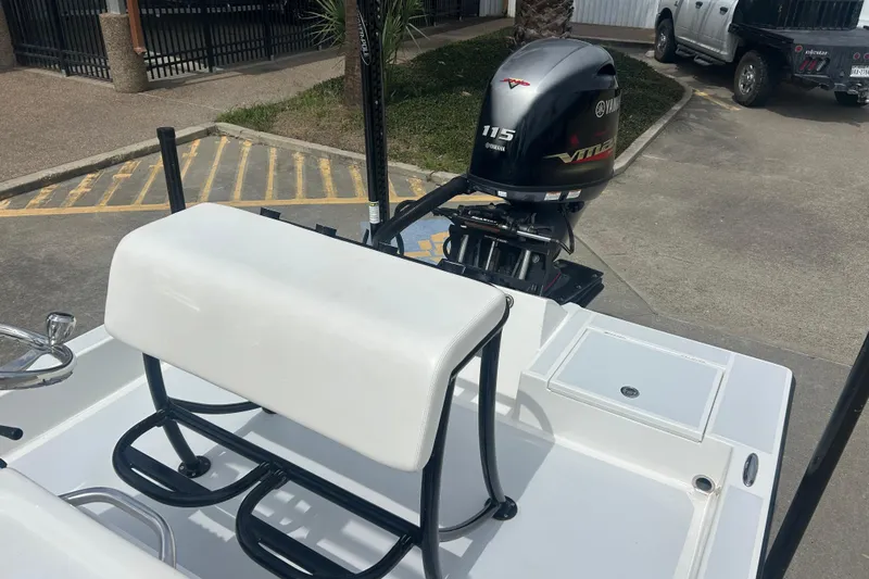 Slide: The Image of 2023 Shallow Sport 18 Sport boat with Yamaha 115 engine, parked outdoors. - 13