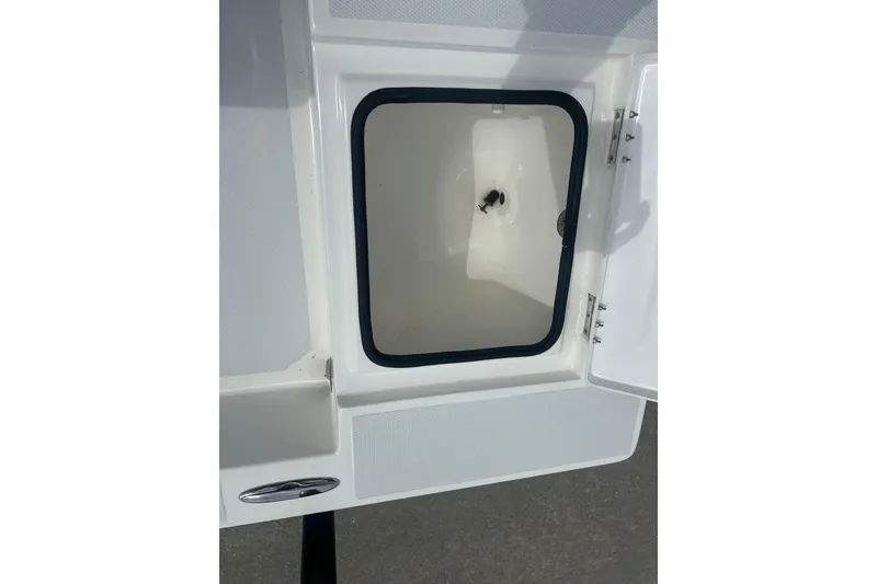 Slide: The Image of Open storage compartment on a 2023 Shallow Sport 18 Sport boat. - 15