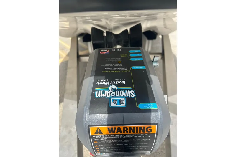 Slide: The Image of Electric winch on 2023 Shallow Sport 18 Sport boat with warning label visible. - 19