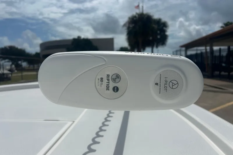 Slide: The Image of Close-up of a 2023 Shallow Sport 18 Sport boat's Riptide i-Pilot trolling motor. - 21