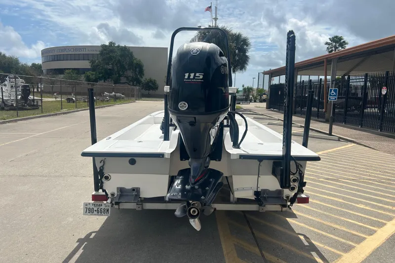 Slide: The Image of 2023 Shallow Sport 18 Sport boat with Yamaha 115 engine, parked in a lot. - 3