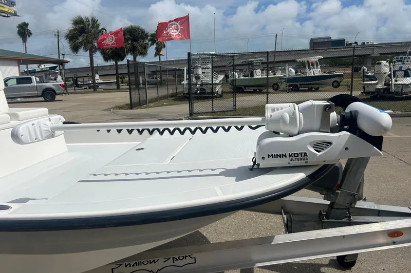 Slide: The Image of 2023 Shallow Sport 18 Sport boat with Minn Kota Ulterra motor on trailer. - 4