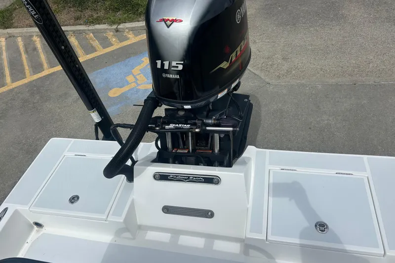 Slide: The Image of 2023 Shallow Sport 18 Sport boat with Yamaha 115 engine, parked on concrete. - 7