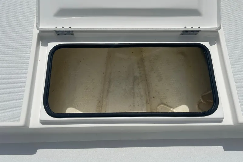 Slide: The Image of Open storage compartment on 2023 Shallow Sport 18 Sport boat. - 9