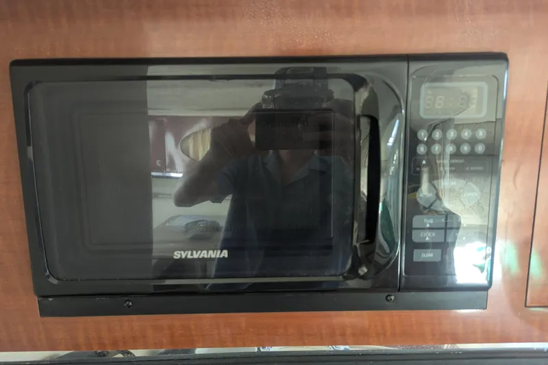Slide: The Image of Sylvania microwave inside 2005 Sea Ray 290 Amberjack boat kitchen area. - 14