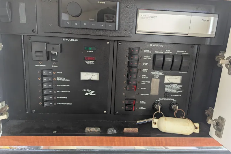 Slide: The Image of Electrical control panel of a 2005 Sea Ray 290 Amberjack boat. - 27