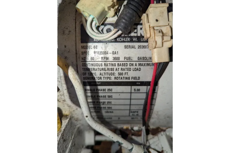 Slide: The Image of Label on Kohler generator in 2005 Sea Ray 290 Amberjack, showing specifications and wiring details. - 36