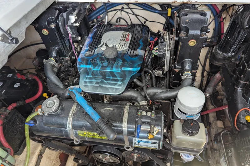 Slide: The Image of Engine compartment of a 2005 Sea Ray 290 Amberjack boat, featuring a MerCruiser engine. - 42