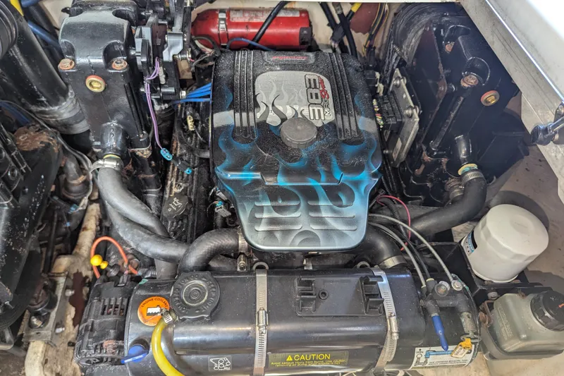 Slide: The Image of Engine compartment of a 2005 Sea Ray 290 Amberjack boat, featuring a 383 Mag Stroker engine. - 44