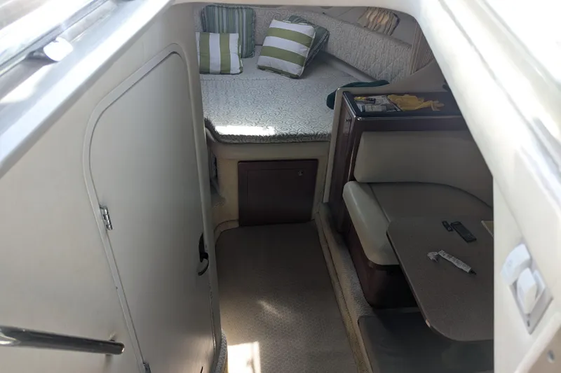 Slide: The Image of Interior cabin of 2005 Sea Ray 290 Amberjack with bed and seating area. - 46