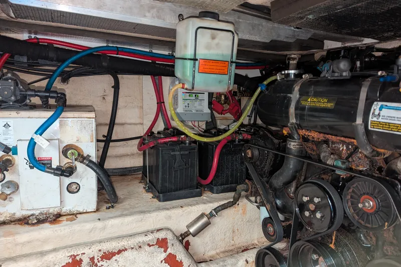 Slide: The Image of Engine compartment of a 2005 Sea Ray 290 Amberjack with visible components and wiring. - 47