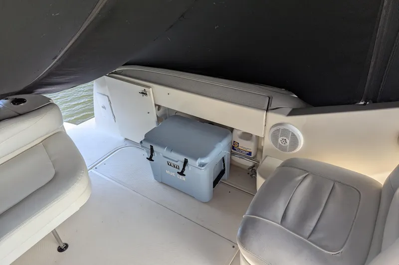 Slide: The Image of Interior of 2005 Sea Ray 290 Amberjack boat with seating and a Yeti cooler. - 51