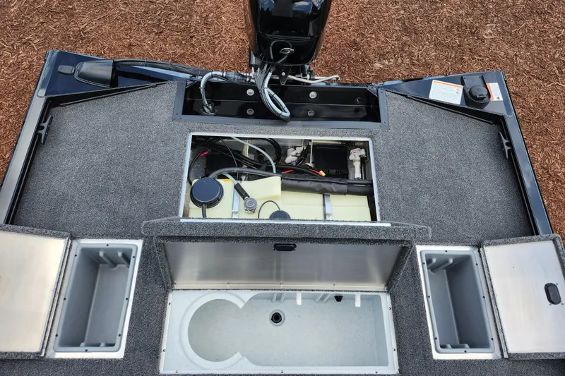 Slide: The Image of 2026 Lowe Stinger 175C boat interior showing storage compartments and engine area. - 13