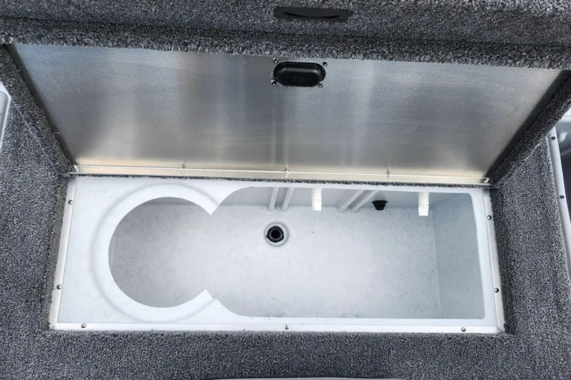 Slide: The Image of Open storage compartment in 2026 Lowe Stinger 175C boat, featuring a spacious interior. - 14