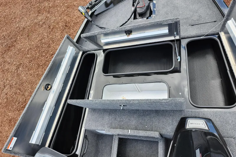 Slide: The Image of 2026 Lowe Stinger 175C boat storage compartments and motor, showcasing spacious design. - 18
