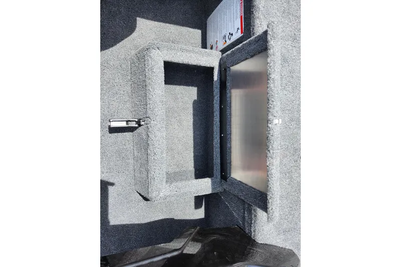 Slide: The Image of Interior view of 2026 Lowe Stinger 175C boat compartment with carpeted finish. - 21