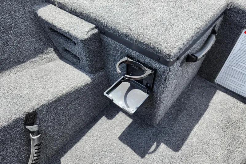 Slide: The Image of Interior of 2026 Lowe Stinger 175C boat with cup holder and carpeted surfaces. - 23