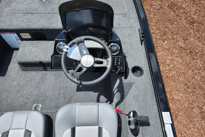 Slide: The Image of 2026 Lowe Stinger 175C boat cockpit with steering wheel and controls. - 26