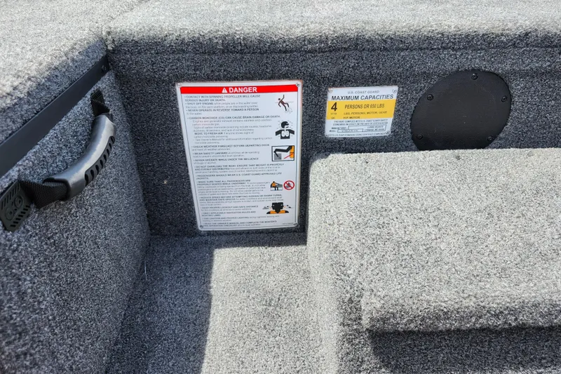 Slide: The Image of Safety warnings and capacity labels on 2026 Lowe Stinger 175C boat interior. - 33