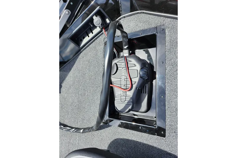 Slide: The Image of 2026 Lowe Stinger 175C boat battery compartment with wiring and secure cover. - 38