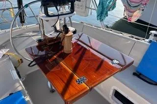 Slide: The Image of 1987 O'Day 40 sailboat cockpit with wooden table and steering wheel. - 4