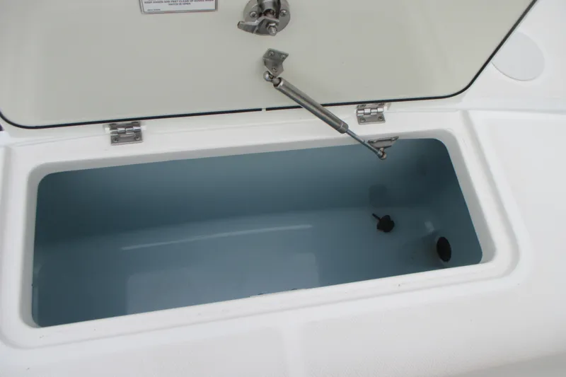 Slide: The Image of Open storage compartment on 2018 Boston Whaler 330 Outrage boat. - 10
