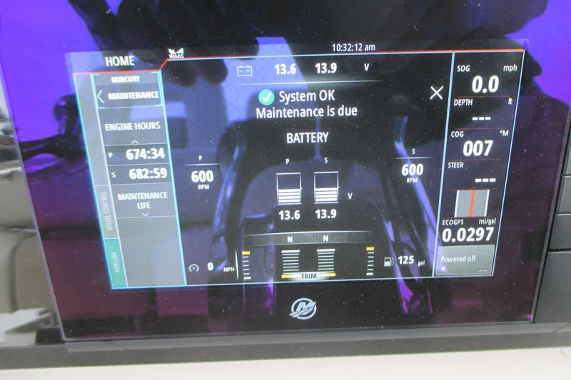 Slide: The Image of Digital display of a 2018 Boston Whaler 330 Outrage showing engine and battery status. - 18