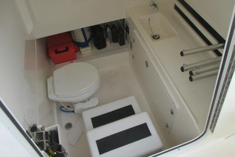 Slide: The Image of Interior of 2018 Boston Whaler 330 Outrage boat with toilet and sink. - 19
