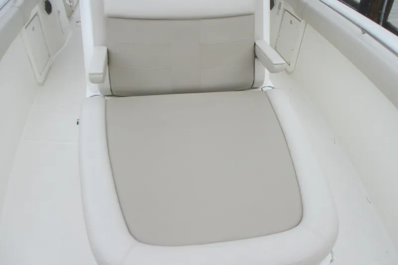 Slide: The Image of Comfortable seating on 2018 Boston Whaler 330 Outrage boat, featuring cushioned upholstery. - 20