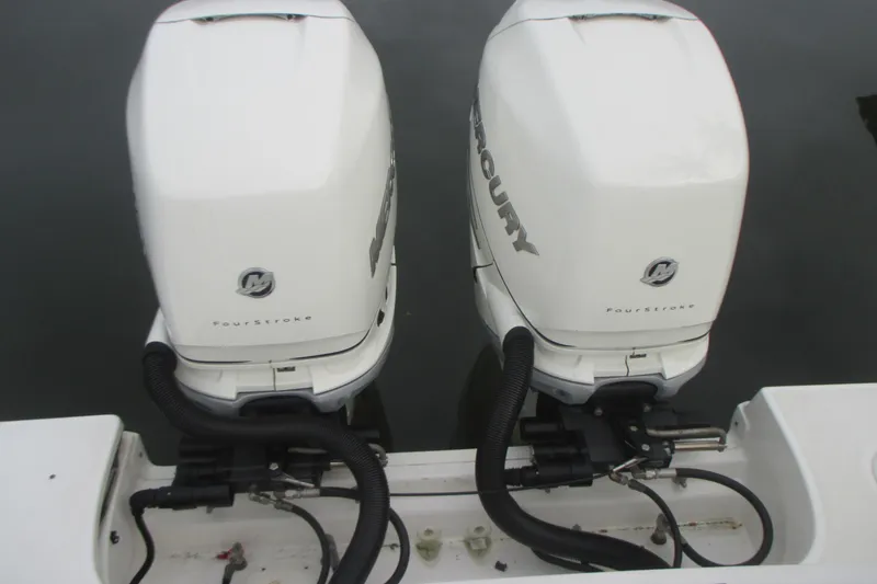 Slide: The Image of Twin Mercury FourStroke engines on a 2018 Boston Whaler 330 Outrage boat. - 7