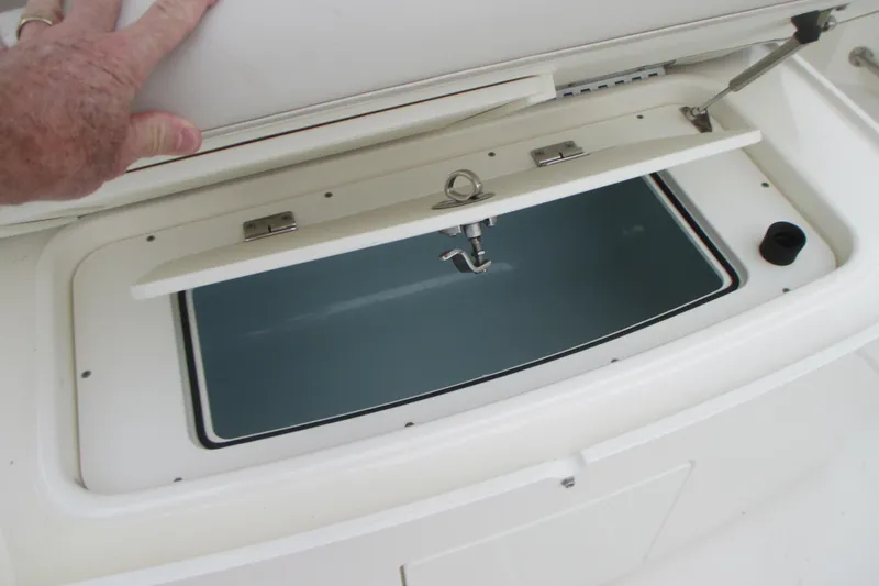 Slide: The Image of Livewell compartment on a 2018 Boston Whaler 330 Outrage boat, open for inspection. - 9