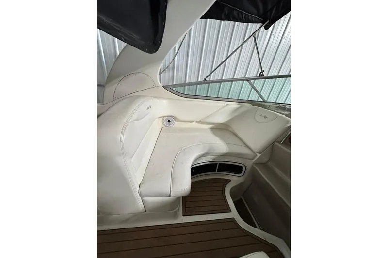 Slide: The Image of Interior view of 2007 Sea Ray Sundancer 280 boat with white seating and wood flooring. - 8