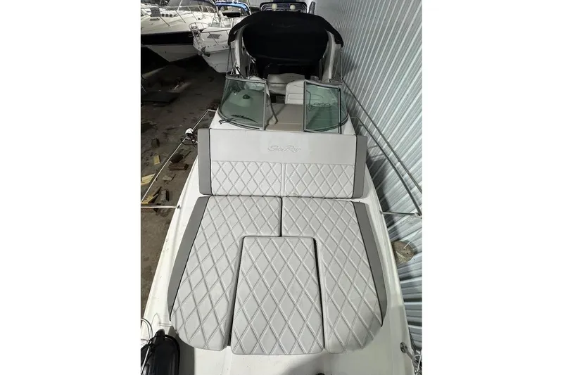 Slide: The Image of 2007 Sea Ray Sundancer 280 with quilted seating, docked indoors. - 9
