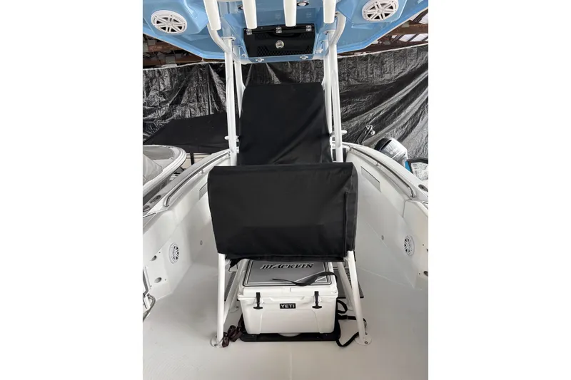Slide: The Image of 2024 Blackfin 222 CC boat interior with seating and storage area. - 3