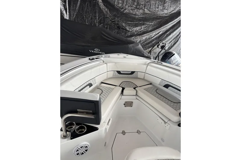 Slide: The Image of 2024 Blackfin 222 CC boat interior with cushioned seating and modern design. - 4