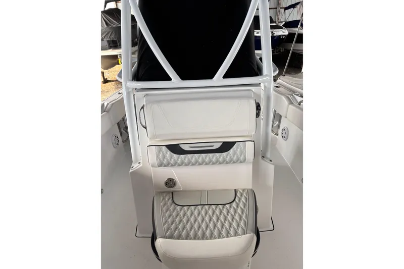 Slide: The Image of 2024 Blackfin 222 CC boat interior with white quilted seating and sleek design. - 5