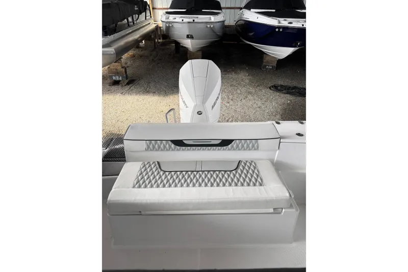 Slide: The Image of 2024 Blackfin 222 CC boat interior with cushioned seating and sleek design. - 6