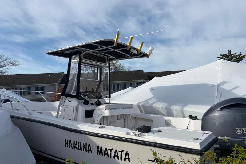 Slide: The Image of 1997 Mako 221 Center Console boat named "Hakuna Matata" with T-top and Yamaha engine. - 7