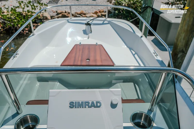 Slide: The Image of 1976 Boston Whaler 17 Montauk boat interior with Simrad navigation system. - 21