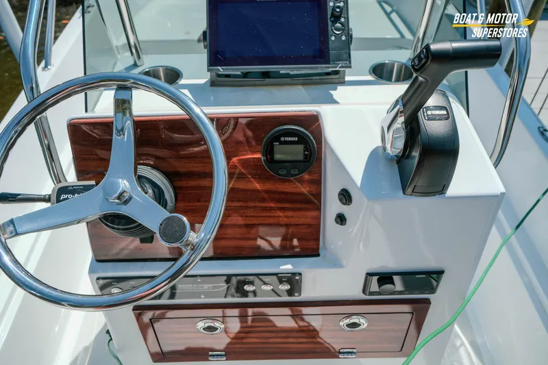 Slide: The Image of Steering console of a 1976 Boston Whaler 17 Montauk boat with Yamaha controls. - 22