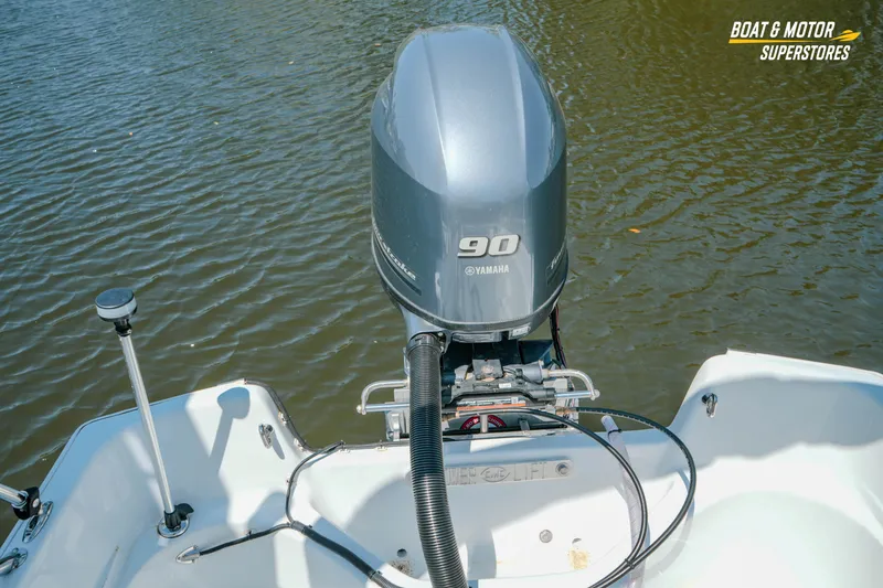 Slide: The Image of 1976 Boston Whaler 17 Montauk with Yamaha 90 outboard motor on water. - 27