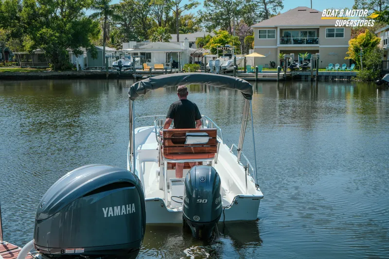 Slide: The Image of 1976 Boston Whaler 17 Montauk boat with Yamaha engine on a calm river. - 38