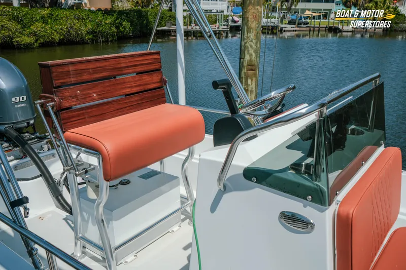 Slide: The Image of 1976 Boston Whaler 17 Montauk boat interior with seating and steering wheel. - 5
