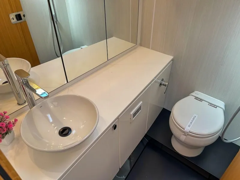 Slide: The Image of Modern bathroom in 2023 Fairline F//Line 33 Outboard yacht with sink and toilet. - 15