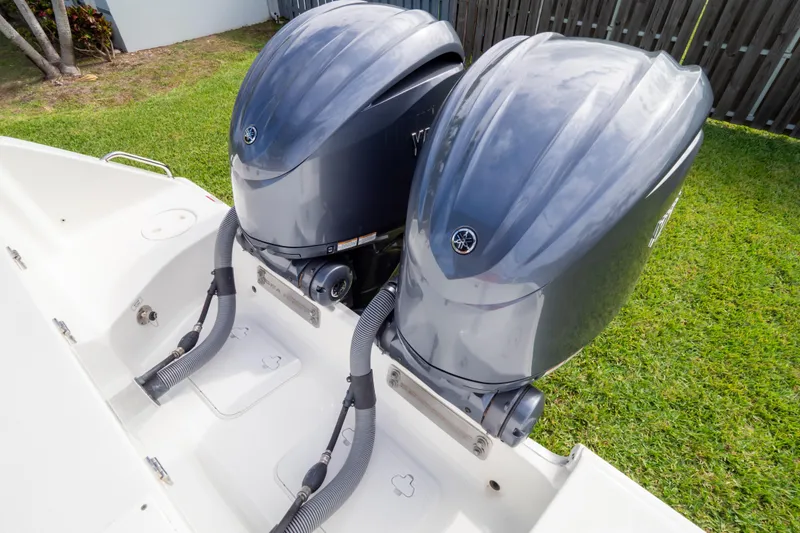 Slide: The Image of 2021 Sea Hunt Gamefish 27 boat interior with brown cushioned seating. - 101