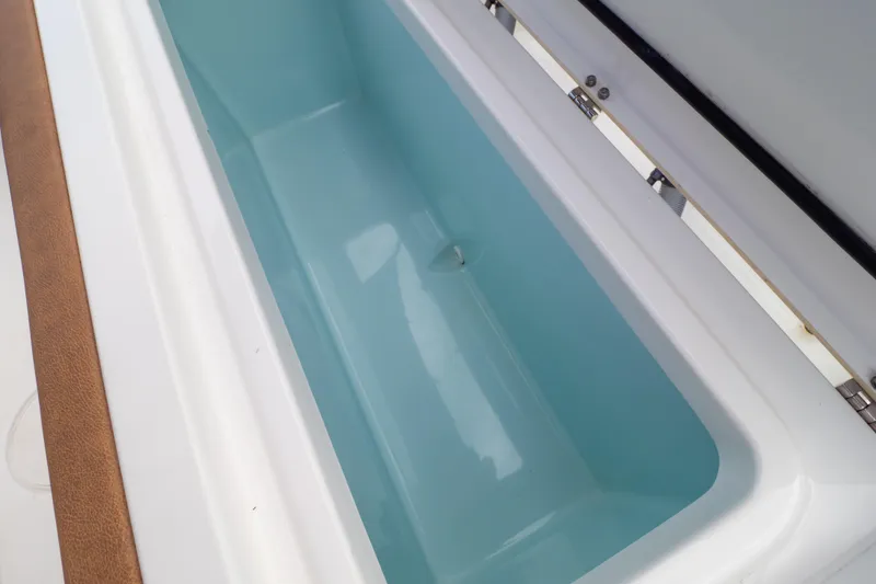 Slide: The Image of 2021 Sea Hunt Gamefish 27 boat engine compartment with hoses and fittings. - 113