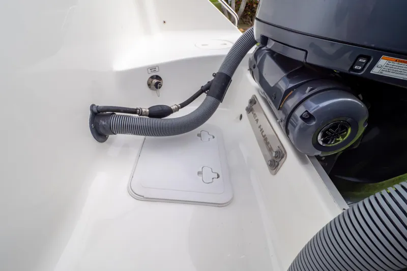 Slide: The Image of 2021 Sea Hunt Gamefish 27 boat with brown forward seating and cup holders. - 115