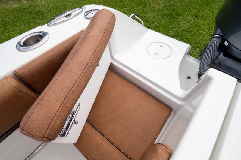 Slide: The Image of 2021 Sea Hunt Gamefish 27 boat with cover, parked on grass, rear view. - 117