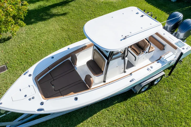 Slide: The Image of 2021 Sea Hunt Gamefish 27 boat with forward seating, viewed from above on grass. - 12