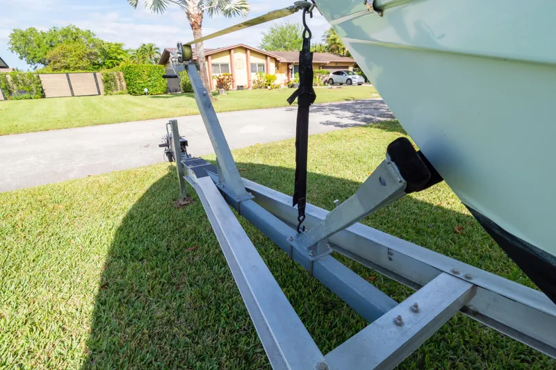 Slide: The Image of Trailer of 2021 Sea Hunt Gamefish 27 boat on grass, showcasing rear view. - 126